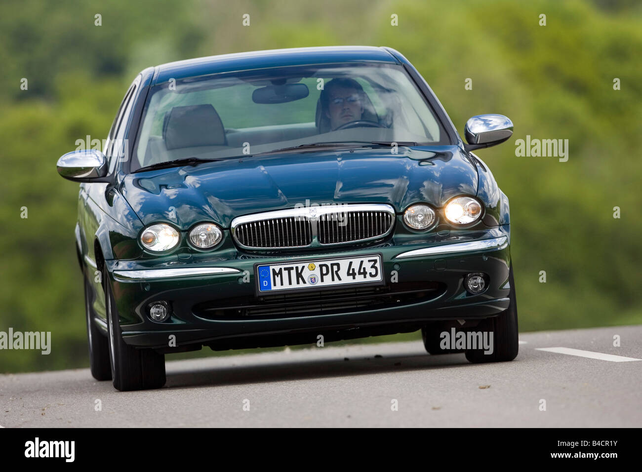 Jaguar X-Type 2.2D, model year 2006-, dark green, driving, diagonal from  the front, frontal view, country road Stock Photo - Alamy
