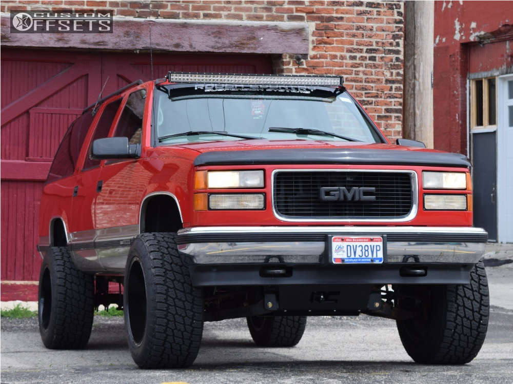 1999 GMC K1500 Suburban with 20x12 -43 Fuel Titan and 305/55R20 Nitto Terra  Grappler G2 and Suspension Lift 6" | Custom Offsets