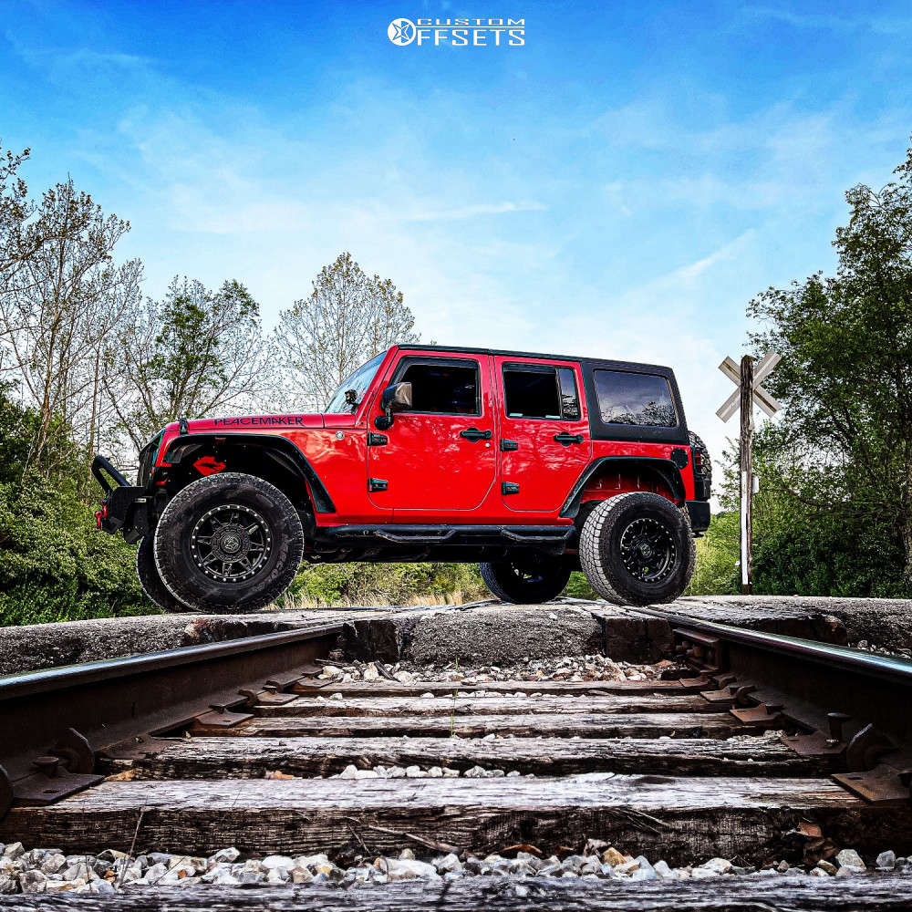 2011 Jeep Wrangler with 17x9 -12 Anthem Off-Road Rogue and 35/12.5R17  Hercules Terra Trac A/t and Suspension Lift 2.5" | Custom Offsets