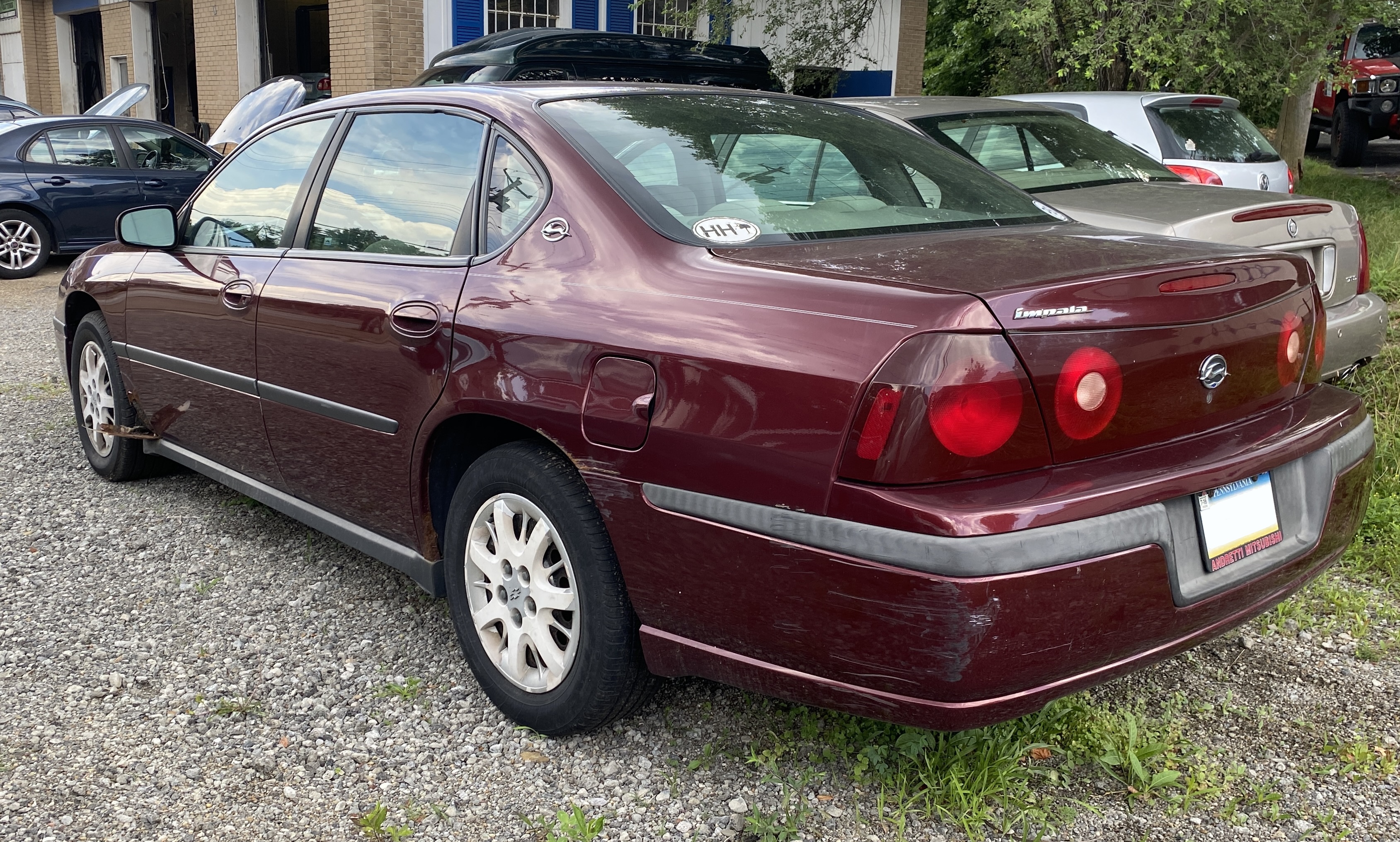 File:2002 Chevrolet Impala LS in Dark Carmine Red Metallic, rear left,  07-22-2022.jpg - Wikimedia Commons